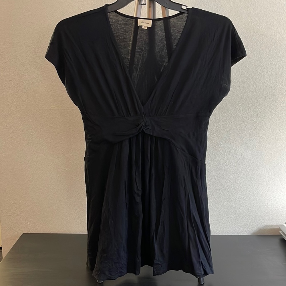 Ella Moss top with tapered waist.